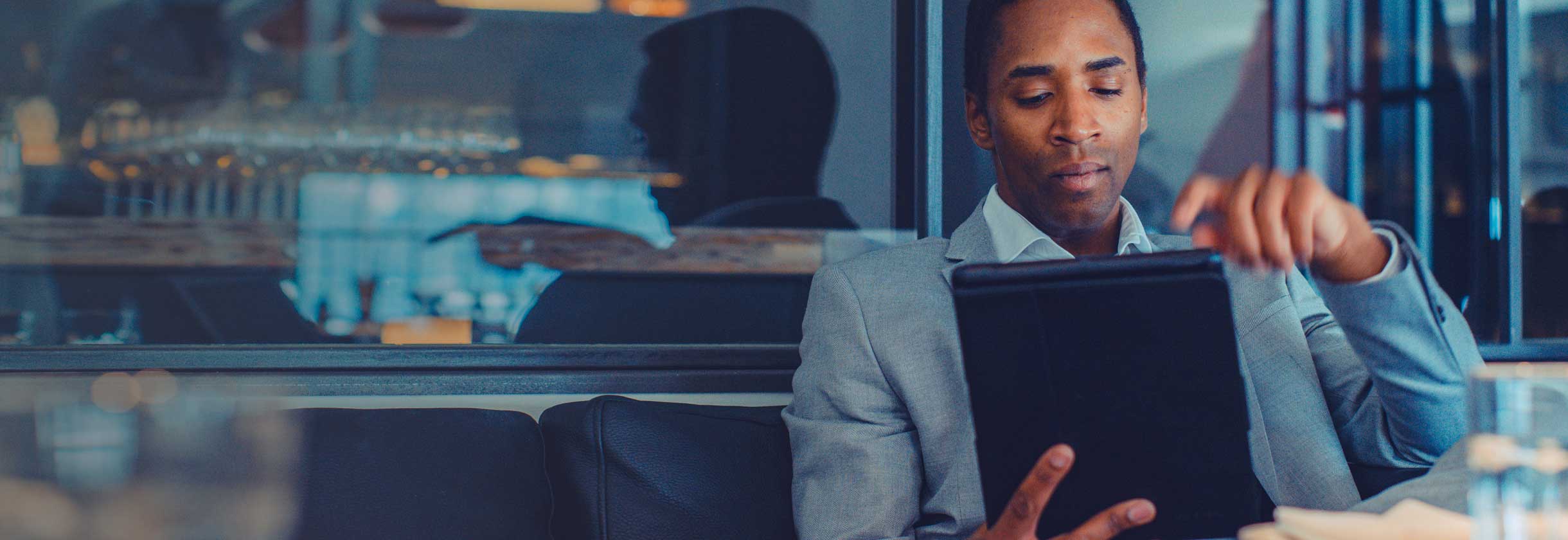 Commercial lending banker on tablet